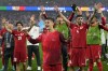 Turkey's Arda Guler, center, celebrates with team mates after a Group F match between Turkey and Georgia at the Euro 2024 soccer tournament in Dortmund, Germany, Tuesday, June 18, 2024. (AP Photo/Martin Meissner)