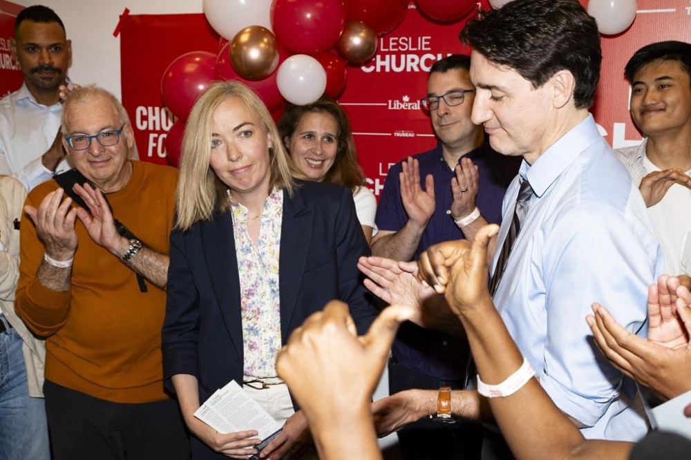Leslie Church seemed to know exactly what was coming as she sat down for an interview in a Toronto park Friday, just three days before the byelection that could complete her journey from longtime political staffer to Liberal member of Parliament. Church, third from left, and Liberal Leader Justin Trudeau speak to supporters at a campaign volunteer event, in Toronto on Thursday, May 30, 2024. THE CANADIAN PRESS/Arlyn McAdorey