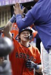 Houston Astros' Jake Meyers celebrates in the dugout after his three-run home run against the Baltimore Orioles during the fifth inning of a baseball game Friday, June 21, 2024, in Houston. (AP Photo/Michael Wyke)