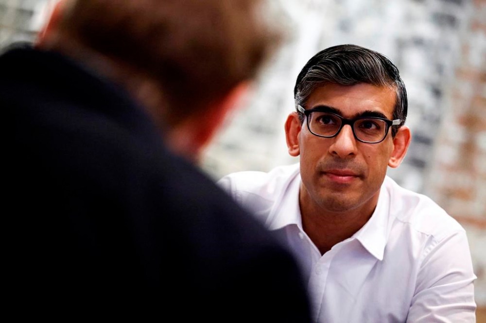 Britain's Prime Minister and Conservative Party leader Rishi Sunak meets with nighttime economy representatives in central London, Saturday June 22, 2024 as part of a campaign event in the build-up to the July 4 general election. (Benjamin Cremel/Pool Photo via AP)