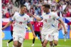 Czech Republic's Patrik Schick, left, celebrates with Czech Republic's Lukas Provod after scoring his side first goal during a Group F match between Georgia and the Czech Republic at the Euro 2024 soccer tournament in Hamburg, Germany, Saturday, June 22, 2024. (AP Photo/Ebrahim Noroozi)