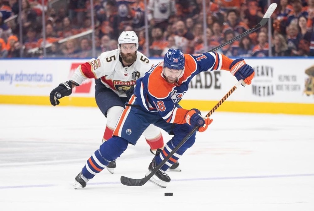 Florida Panthers' Aaron Ekblad (5) chases Edmonton Oilers' Zach Hyman (18) on the breakaway during second period Game 6 action of the NHL Stanley Cup finals in Edmonton, Friday, June 21, 2024. A win away from rewriting some NHL history, the Oilers headed to Florida on Saturday for Monday's Game 7 that seemed improbable a week earlier. THE CANADIAN PRESS/Jason Franson