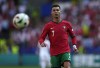 Portugal's Cristiano Ronaldo looks the ball during a Group F match between Turkey and Portugal at the Euro 2024 soccer tournament in Dortmund, Germany, Saturday, June 22, 2024. (AP Photo/Themba Hadebe)