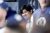Los Angeles Dodgers' Shohei Ohtani sits in the dugout prior to a baseball game against the Los Angeles Angels Saturday, June 22, 2024, in Los Angeles. (AP Photo/Mark J. Terrill)