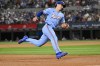 Texas Rangers' Wyatt Langford scores on a single hit by Lady Taveras in the fifth inning of a baseball game against the Kansas City Royals, Sunday, June 23, 2024, in Arlington, Texas. (AP Photo/Albert Pena)