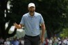 Scottie Scheffler gestures after making birdie on the seventh hole during the final round of the Travelers Championship golf tournament at TPC River Highlands, Sunday, June 23, 2024, in Cromwell, Conn. (AP Photo/Seth Wenig)