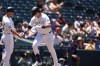 Colorado Rockies third base coach Warren Schaeffer, let, congratulates Michael Toglia, right, who circles the bases after hitting a solo home run off Washington Nationals starting pitcher Jake Irvin in the second inning of a baseball game Sunday, June 23, 2024, in Denver. (AP Photo/David Zalubowski)