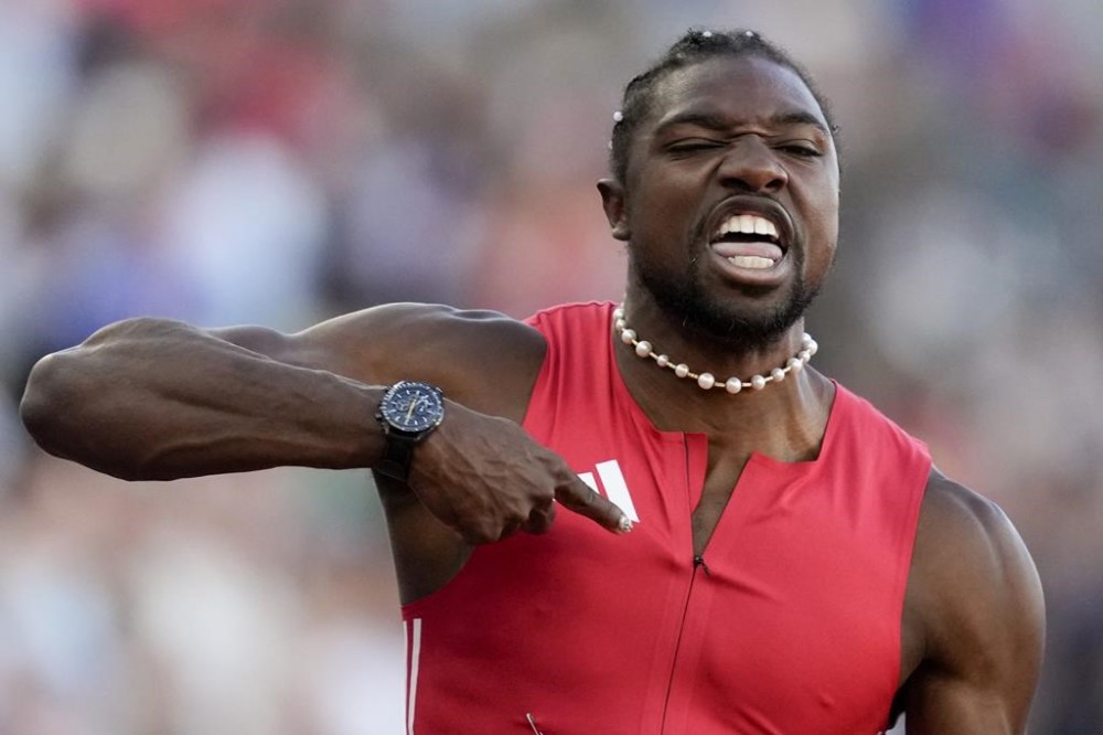 Noah Lyles celebrates after winning the men's 100-meter final during the U.S. Track and Field Olympic Team Trials Sunday, June 23, 2024, in Eugene, Ore. (AP Photo/Charlie Neibergall)