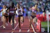 Athing Mu wins a heat in the women's 800-meter semi-final as Kate Grace and Michaela Rose collide during the U.S. Track and Field Olympic Team Trials Sunday, June 23, 2024, in Eugene, Ore. (AP Photo/Charlie Neibergall)