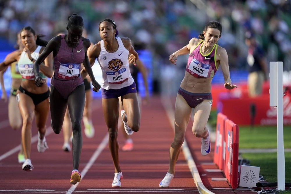Athing Mu wins a heat in the women's 800-meter semi-final as Kate Grace and Michaela Rose collide during the U.S. Track and Field Olympic Team Trials Sunday, June 23, 2024, in Eugene, Ore. (AP Photo/Charlie Neibergall)