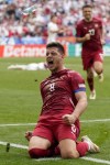 Serbia's Luka Jovic celebrates after scoring his side first goal during a Group C match between Slovenia and Serbia at the Euro 2024 soccer tournament in Munich, Germany, Thursday, June 20, 2024. (AP Photo/Matthias Schrader)