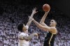FILE - Purdue's Zach Edey (15) shoots over Indiana's Kel'el Ware during the first half of an NCAA college basketball game Jan. 16, 2024, in Bloomington, Ind. Edey is among the headliners of the big men in the upcoming NBA draft.(AP Photo/Darron Cummings, File)
