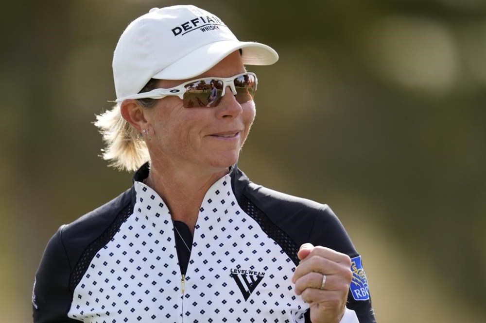 Alena Sharp smiles after her shot on the 10th green during the first round of LPGA Ford Championship golf tournament, Thursday, March 28, 2024, in Gilbert, Ariz. Canada's golf team for the Paris Olympics is complete, with Brooke Henderson and Sharp set to play in the women's event. THE CANADIAN PRESS/AP/Matt York
