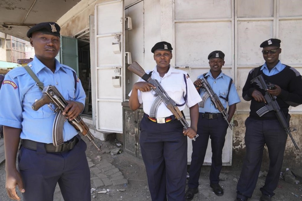 FILE - Kenya police patrol the streets of Nairobi, Kenya Tuesday, March.12, 2024. Hundreds of Kenyan police officers are leaving for Haiti, where they will lead a multinational force against powerful gangs. (AP Photo/Brian Inganga, File)
