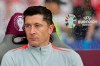 Poland's Robert Lewandowski sits on the substitute the bench before the start of a Group D match between Poland and Austria at the Euro 2024 soccer tournament in Berlin, Germany, Friday, June 21, 2024. (Andreas Gora/dpa via AP)
