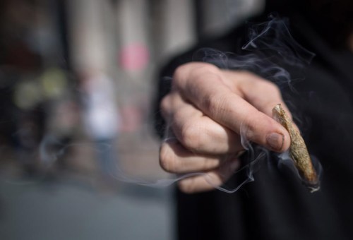 Cannabis has edged out alcohol as the most commonly detected single substance with Atlantic provinces leading the country in number of injured drivers who are more likely to have used weed, says a new study. A man holds a joint while smoking marijuana, in Vancouver on Wednesday Oct. 17, 2018. THE CANADIAN PRESS/Darryl Dyck