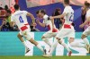 Croatia's Luka Modric celebrates with team mates after scoring his side's opening goal during a Group B match between Croatia and Italy at the Euro 2024 soccer tournament in Leipzig, Germany, Monday, June 24, 2024. (AP Photo/Petr David Josek)