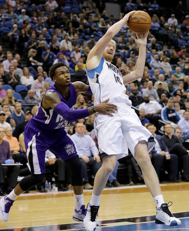 FILE - Minnesota Timberwolves forward Chase Budinger (10) is fouled by Sacramento Kings guard Ben McLemore, left, during the third quarter of an NBA basketball game in Minneapolis, Saturday, Nov. 22, 2014. After a seven-year career in the NBA, Budinger still had some goals left on his dream board.It will be beach volleyball – not basketball – that eventually landed him on Team USA. Budinger, who didn’t start playing regularly on the beach until after his NBA career ended, qualified this month for the Summer Games with partner Miles Evans and both will be making their Olympic debuts in Paris. (AP Photo/Ann Heisenfelt)