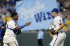 Kansas City Royals catcher Salvador Perez, left, and relief pitcher James McArthur celebrate after their baseball game against the Miami Marlins Monday, June 24, 2024, in Kansas City, Mo. The Royals won 4-1. (AP Photo/Charlie Riedel)