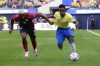 Costa Rica's Jeyland Mitchell, left, defends on Brazil's Vinicius Junior during a Copa America Group D soccer match Monday, June 24, 2024, in Inglewood, Calif. (AP Photo/Mark J. Terrill)
