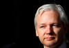 FILE - WikiLeaks founder Julian Assange pauses as he makes a statement to media gathered outside the High Court in London, on Dec. 5, 2011. Assange will plead guilty to a felony charge in a deal with the U.S. Justice Department that will free him from prison and resolve a long-running legal saga over the publication of a trove of classified documents. (AP Photo/Kirsty Wigglesworth, File)