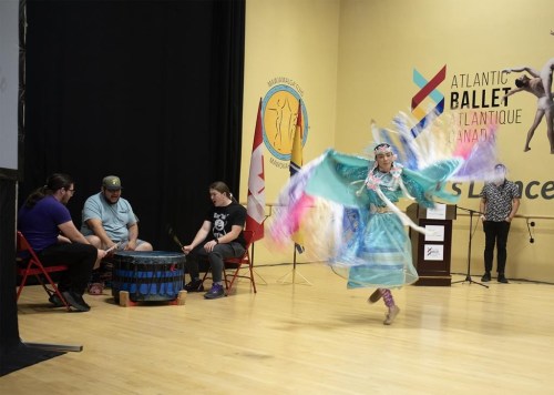 Precious Abygail Dedam, of Esgenoopetitj (Burnt Church, First Nation) dances during the announcement for the new intercultural Indigenous dance program as The Wabanaki Confederacy drum group provide the music in Moncton, N.B., on Monday June 25, 2024. THE CANADIAN PRESS/Ron Ward
