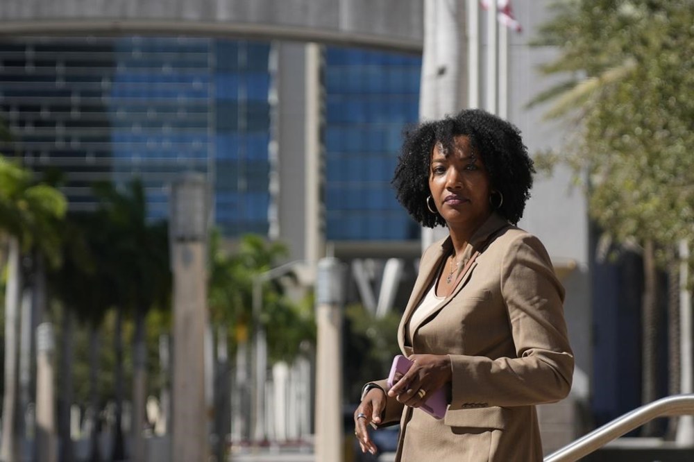 FILE - Ayana Parsons, one of the co-founders and CEOs of The Fearless Fund, walks outside the James Lawrence King Federal Building in Miami, Jan. 31, 2024, following a hearing. On Monday, June 24, 2024, Parsons, one of the co-founders of the Atlanta-based venture capital firm that supports women of color, stepped down as chief operating officer as the company battles a lawsuit that has become emblematic of a conservative backlash against corporate diversity programs. (AP Photo/Rebecca Blackwell, File)