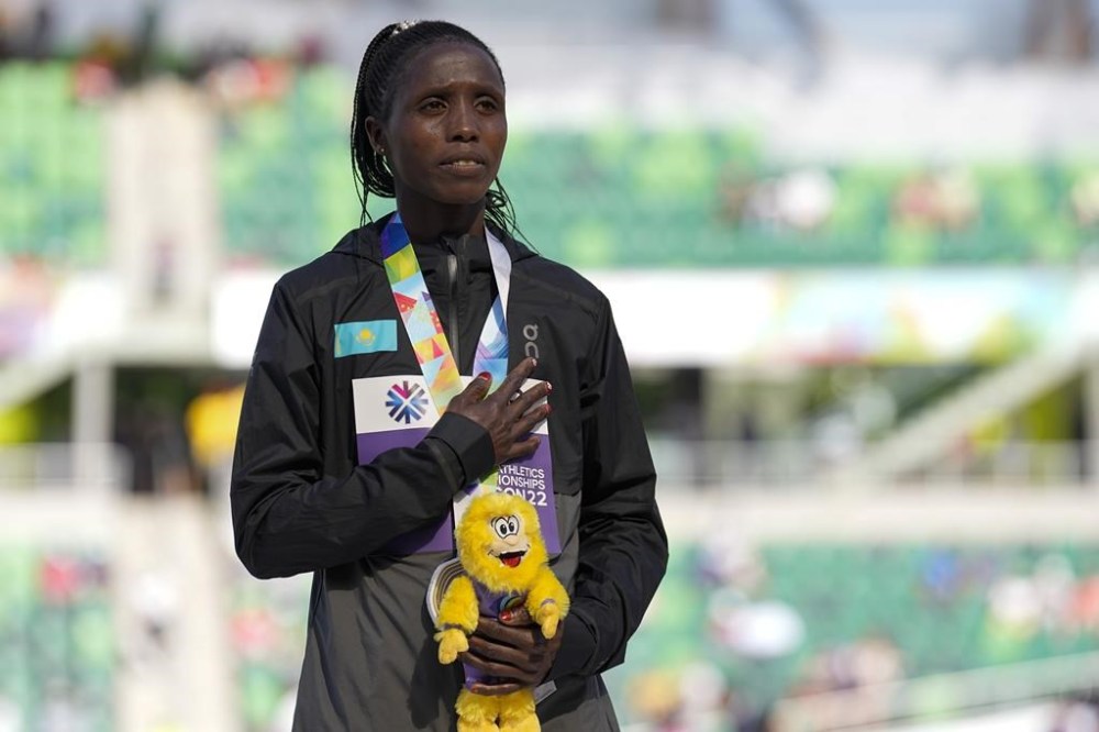 FILE - Gold medalist Norah Jeruto, of Kazakhstan, poses during a medal ceremony for the women's 3000-meter steeplechase at the World Athletics Championships on July 21, 2022, in Eugene, Ore. Jeruto is on course to race at the Paris Olympics after track and field’s world governing body failed in an attempt to have her banned in a doping case. Jeruto was born in Kenya and won the world title for Kazakhstan two years ago. (AP Photo/Gregory Bull, File)