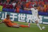 Austria's Marcel Sabitzer (9) scores a goal past Micky van de Ven of the Netherlands (15) during a Group D match at the Euro 2024 soccer tournament in Berlin, Germany, Tuesday, June 25, 2024. (AP Photo/Sunday Alamba)