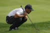 Xander Schauffele lines up a putt on the 18th hole during the final round of the Travelers Championship golf tournament at TPC River Highlands, Sunday, June 23, 2024, in Cromwell, Conn. (AP Photo/Seth Wenig)