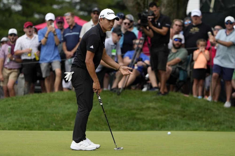 Collin Morikawa reacts to missing a putt on the seventh hole during the final round of the Travelers Championship golf tournament at TPC River Highlands, Sunday, June 23, 2024, in Cromwell, Conn. (AP Photo/Seth Wenig)