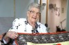 Angeline Charlebois, 105, shows off one of the many quilts she created at her home in Levack, Ont., Saturday, June 22, 2024. THE CANADIAN PRESS/Gino Donato