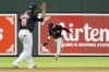 Cleveland Guardians third baseman Jose Ramirez (11) celebrates as Cleveland Guardians left fielder Steven Kwan, right, makes the game-winning catch against Baltimore Orioles' Adley Rutschman during the ninth inning of a baseball game, Tuesday, June 25, 2024, in Baltimore. (AP Photo/Stephanie Scarbrough)