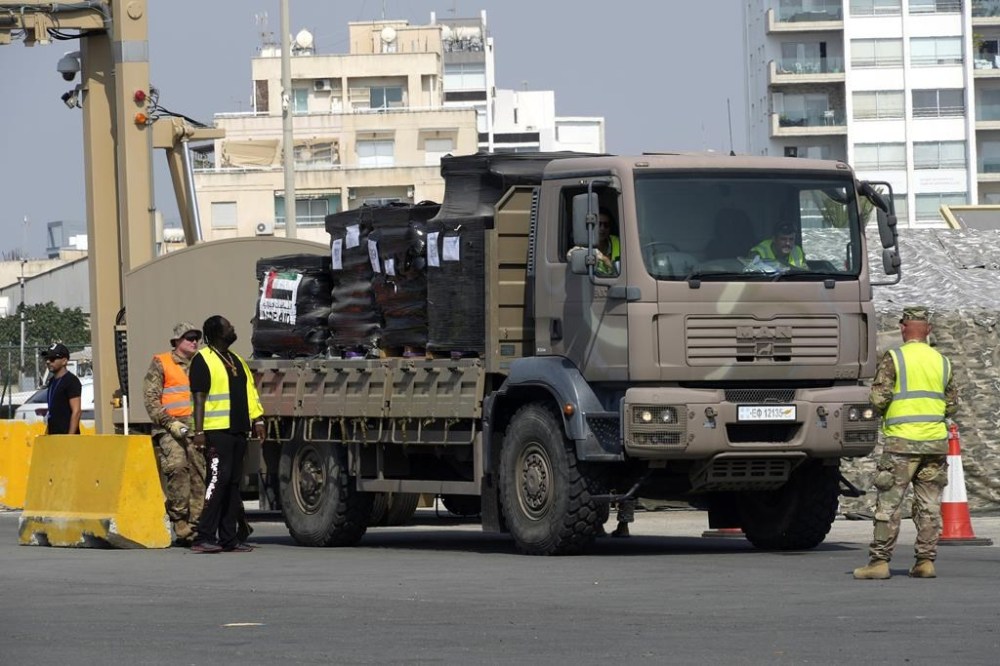 A truck carrying Gaza aid is about to enter a U.S ship, at the port of Larnaca, Cyprus, Wednesday, June 26, 2024. An official with the U.S. humanitarian assistance agency USAID says thousands of tons of food, medicines and other aid piled up on a Gaza beach isn't reaching those in need because of a dire security situation on the ground where truck drivers are either getting caught in the crossfire or have their cargo seized by