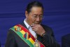 FILE - Bolivian President Luis Arce attends an Indigenous ritual before delivering his annual state of the nation address at the presidential palace in La Paz, Bolivia, Jan. 22, 2024. Armored vehicles rammed into the doors of Bolivia's government palace Wednesday, June 26, 2024, as a top government official warned of a coup attempt. (AP Photo/Juan Karita, File) (AP Photo/Juan Karita, File)