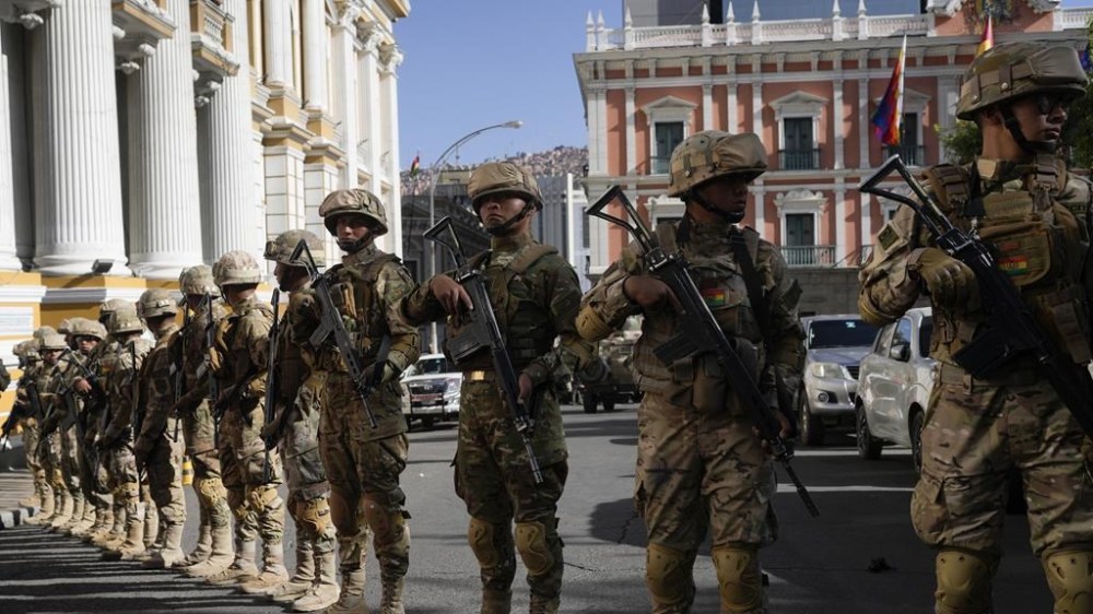Soldiers block the street in front of the presidential palace, right, and the Legislative Assembly, left, in Plaza Murillo in La Paz, Bolivia, Wednesday, June 26, 2024. (AP Photo/Juan Karita)