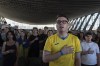 Ukraine fans sing national anthem during a public screening of the Euro 2024 match between Ukraine and Belgium in Kyiv, Ukraine, on Wednesday, June 26, 2024. (AP Photo/Alex Babenko)