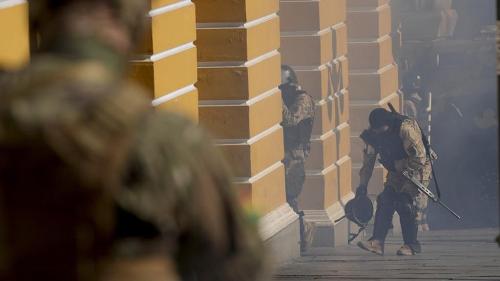 Soldiers walk amid tear gas they fired outside the Legislative Assembly in Plaza Murillo in La Paz, Bolivia, Wednesday, June 26, 2024. (AP Photo/Juan Karita)