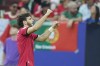 Georgia's Khvicha Kvaratskhelia celebrates after scoring his side's first goal during a Group F match between Georgia and Portugal at the Euro 2024 soccer tournament in Gelsenkirchen, Germany, Wednesday, June 26, 2024. (AP Photo/Alessandra Tarantino)
