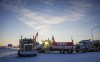 A truck convoy of anti-COVID-19 vaccine mandate demonstrators block the highway at the busy U.S. border crossing in Coutts, Alta., Wednesday, Feb. 2, 2022. A police phone expert is to continue testifying today at the trial for two men charged with conspiracy to commit murder at the border blockade at Coutts, Alta. THE CANADIAN PRESS/Jeff McIntosh