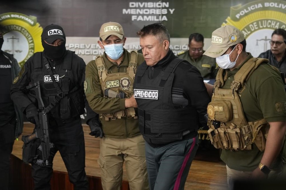 Bolivian police hold the detained Juan Jose Zuniga, former general commander of the Army, in La Paz, Bolivia, Wednesday, June 26, 2024. An apparent failed coup attempt erupted Wednesday in the country, and Zuniga appeared to be leading the rebellion. (AP Photo/Juan Karita)