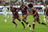 Venezuela's Salomon Rondon, center, celebrates scoring his side's opening goal from the penalty spot during a Copa America Group B soccer match Wednesday, June 26, 2024, in Inglewood, Calif. (AP Photo/Ryan Sun)