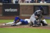 New York Mets' Brandon Nimmo slides past New York Yankees catcher Jose Trevino to score on a double by Francisco Alvarez during the fifth inning of a baseball game Wednesday, June 26, 2024, in New York. (AP Photo/Frank Franklin II)