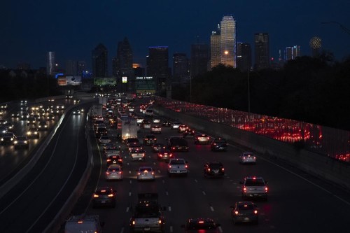 FILE - Vehicles travel along Interstate-30 with the Dallas skyline seen in the distance, Nov. 27, 2023. On Thursday, June 27, 2024, the U.S. Census Bureau released population estimates which showed Texas leading all other states in new Hispanic, Asian and Black residents added last year. (AP Photo/Julio Cortez, File)