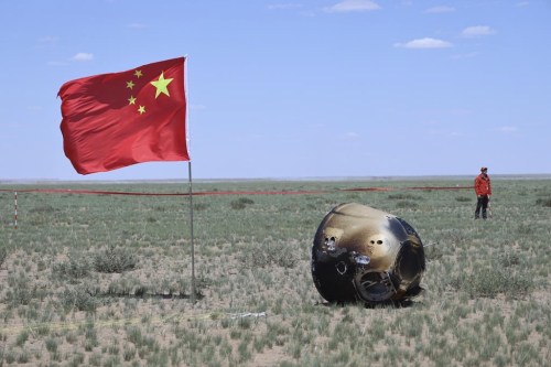 In this photo released by Xinhua News Agency, the return capsule of the Chang'e 6 probe is seen in Siziwang Banner, northern China's Inner Mongolia Autonomous Region on Tuesday, June 25, 2024. China's Chang'e 6 probe has returned on Earth with rock and soil samples from the little-explored far side of the moon in a global first. (Bei He/Xinhua via AP)