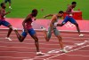FILE - Andre De Grasse, of Canada, races to win the gold medal ahead of Kenneth Bednarek, foreground, of the United States, silver, and Noah Lyles, right, of the United States, bronze, in the final of the men's 200-meters at the 2020 Summer Olympics, Wednesday, Aug. 4, 2021, in Tokyo, Japan. De Grasse manages to stay under the radar most of the time, but has a knack for turning up big when the lights are shining the brightest. (Nathan Denette/The Canadian Press via AP, File)