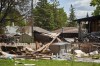 Debris is shown scattered at the scene of a house explosion in Winnipeg, Wednesday, June 26, 2024. Police have confirmed the occupants of the home destroyed in the blast have been located and are safe. THE CANADIAN PRESS/David Lipnowski