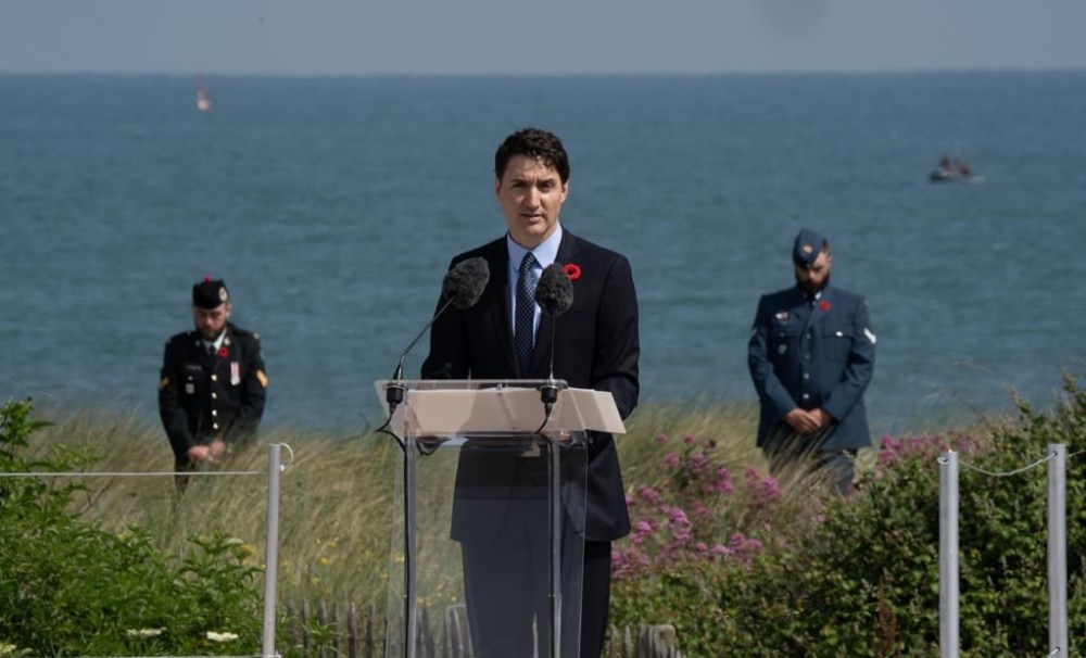 Prime Minister Justin Trudeau speaks at Juno Beach, Thursday, June 6, 2024 in Courselles-sur-Mer., France., during the Canadian National Ceremony commemorating the 80th anniversary of D-Day and the Battle of Normandy. THE CANADIAN PRESS/Adrian Wyld