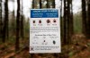 In this photo made Friday, May 9, 2014, an informational card about ticks distributed by the Maine Medical Center Research Institute is seen in the woods in Freeport, Maine. THE CANADIAN PRESS/AP-Robert F. Bukaty