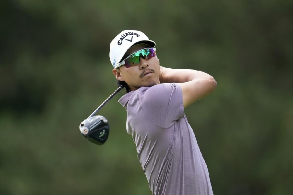 Min Woo Lee hits off the fourth tee during the first round of the Rocket Mortgage Classic golf tournament at Detroit Country Club, Thursday, June 27, 2024, in Detroit. (AP Photo/Paul Sancya)